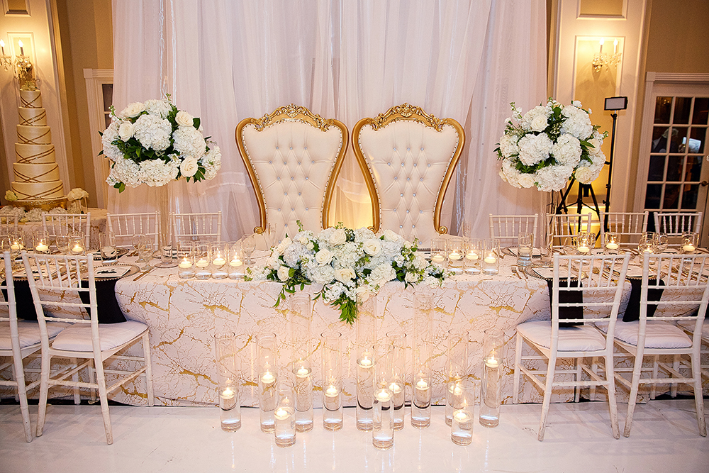 his and her chairs at wedding reception