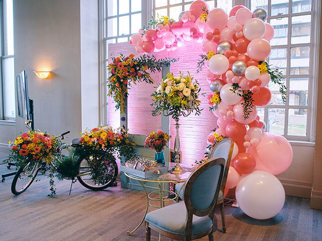 haute flowers, balloon arch, garden wedding, spring theme, bicycle, bright flowers