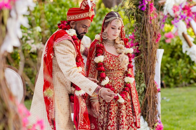 At the Hindu ceremony, the bride and groom participate in traditional rituals. 