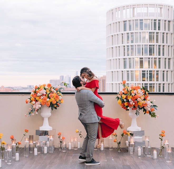 A couple hugging on the rooftop of Hilton Houston Plaza Medical Center. 