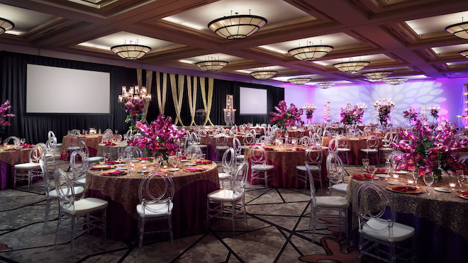 The ballroom of Hyatt Regency Houston West with pink wedding decor. 