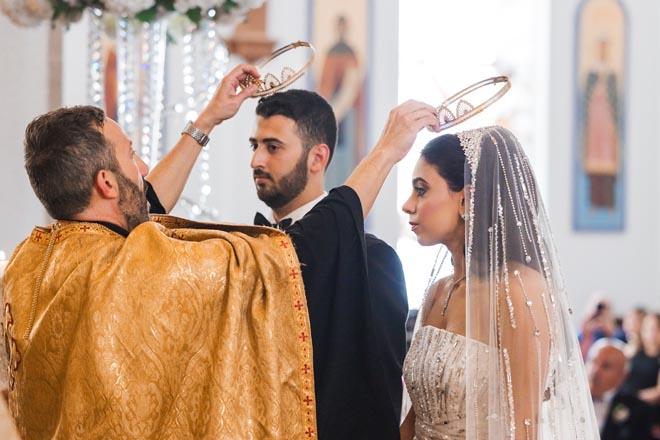 At their traditional wedding ceremony, crowns are placed on top of the bride and groom's head.