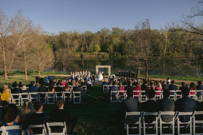 The bride and groom exchange vows with a sunk-kissed al fresco wedding by the Colorado River.