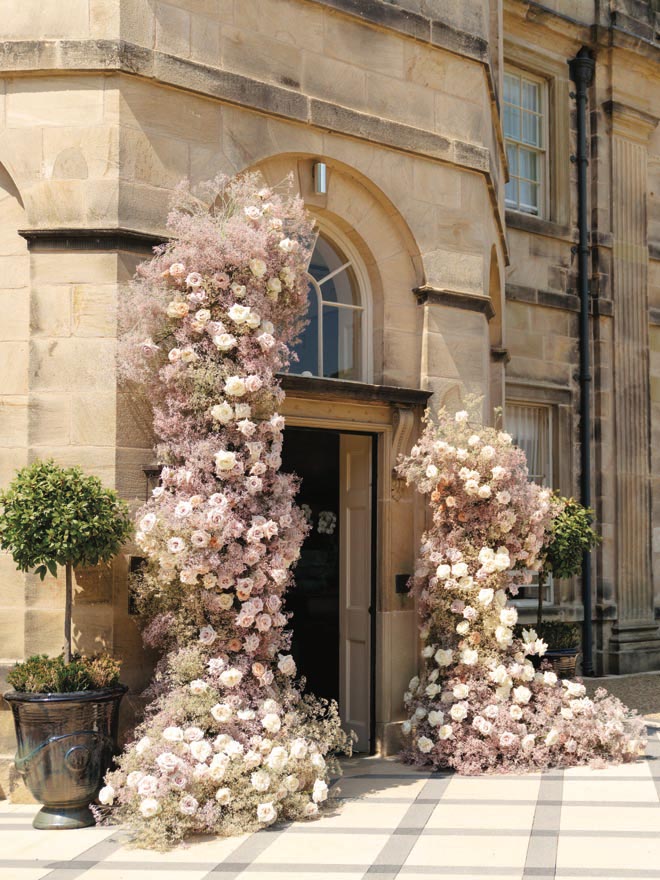Blush, ivory and lavender-colored flowers decorate the entry way of Grantley Hall. 