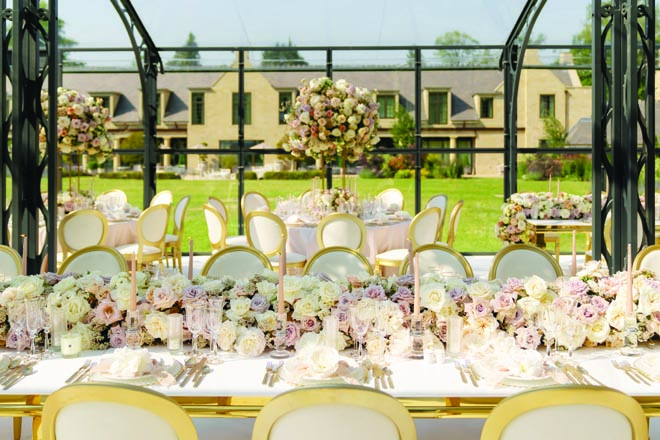 A dinner party takes place in a glass atrium after the couple's outdoor wedding ceremony.