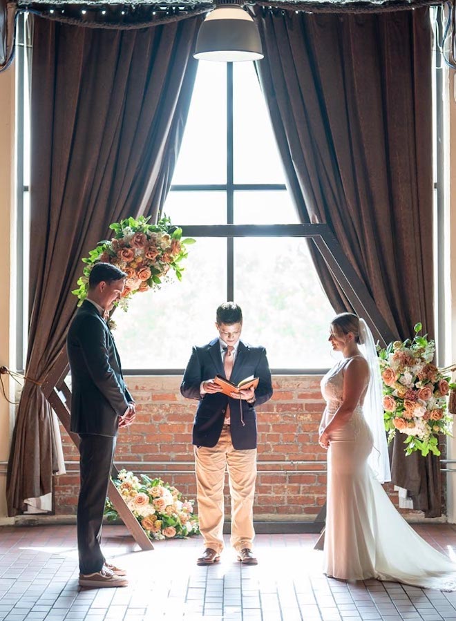 The bride and groom had their wedding ceremony in the German-inspired beer hall at Saint Arnold Brewery.