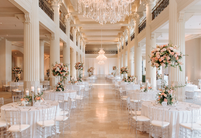 The historic wedding venue, the Corinthian Houston is detailed in pastel flowers and white tablescapes.