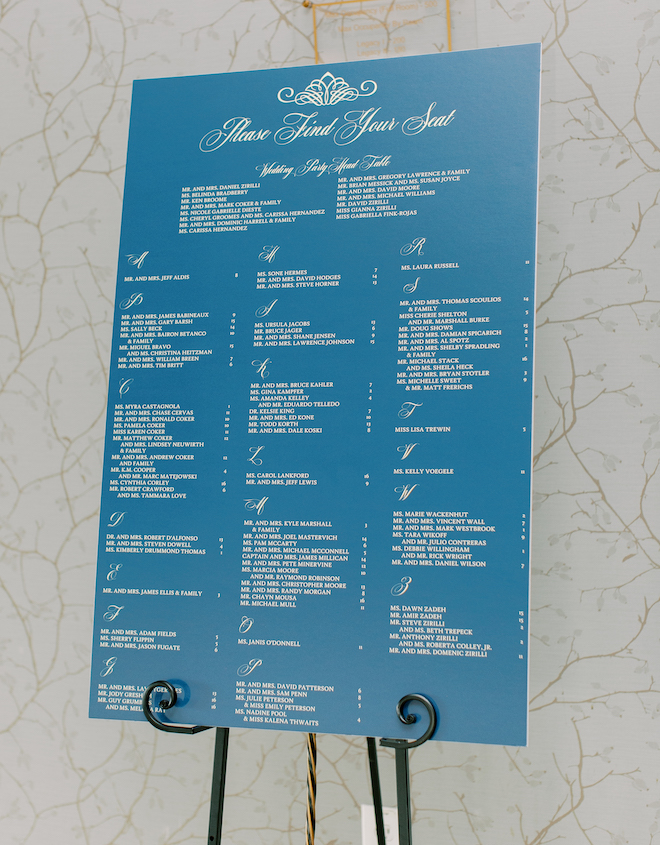 A blue seating chart with gold lettering.