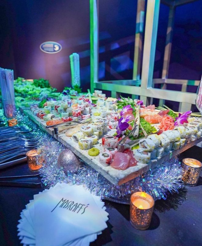 A variety of sushi rolls from Masraff's Catering are displayed at an event in Houston.