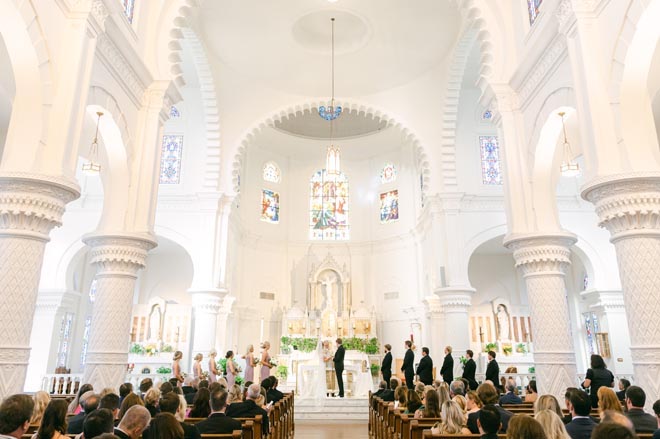 The bride and groom wed with a traditional church ceremony in Galveston.