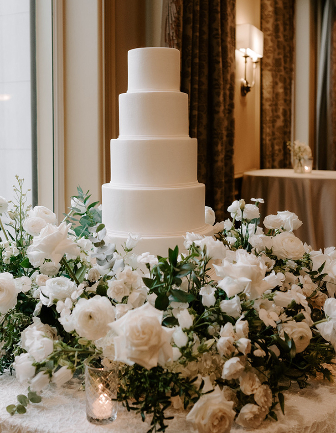 A five-tier white cake by Cakes by Gina. 