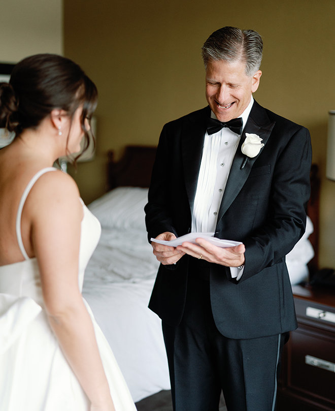 The bride giving her father a note before the wedding. 