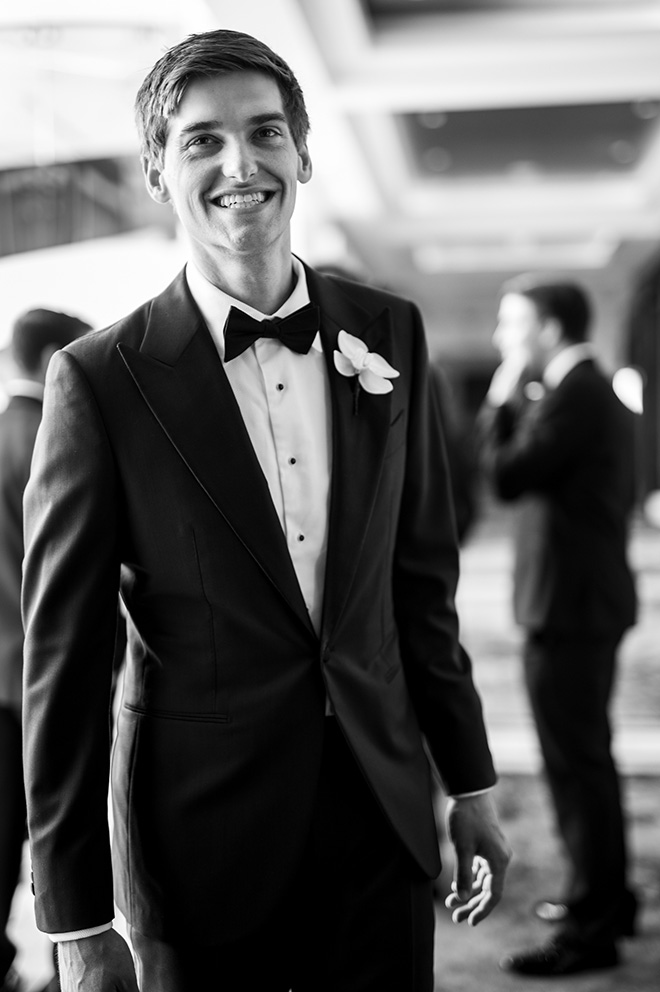 The groom smiles before he walks down the aisle at his traditional church ceremony.