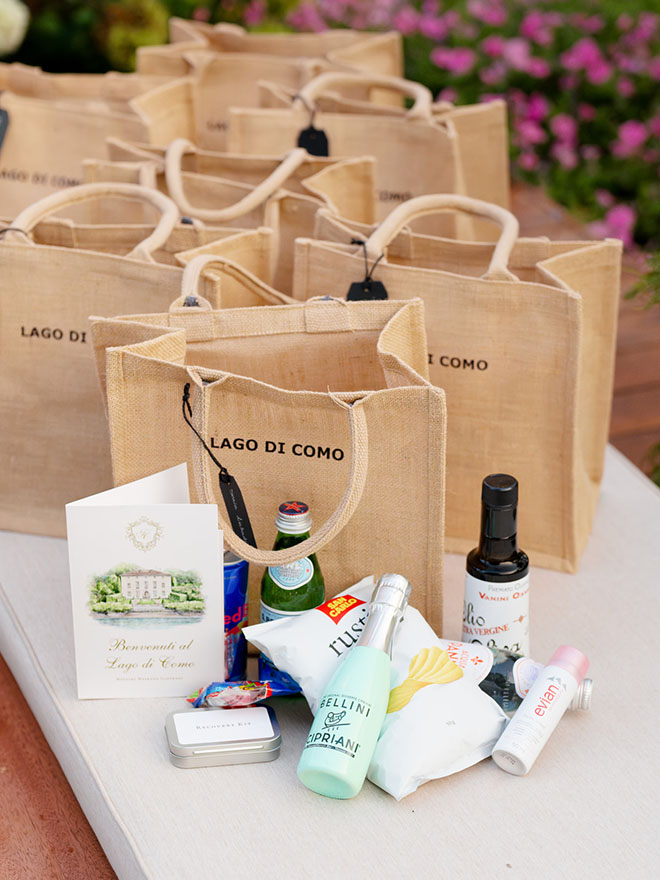 The wedding favors at the welcome dinner are filled with snacks and beverages for guests.