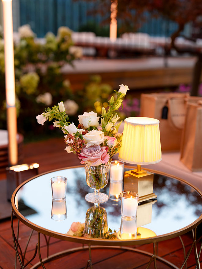 White and pink roses decorate the tables at a welcome dinner in Lake Como, Italy.