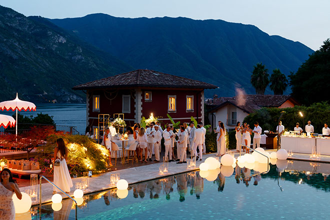 Guests wear white clothing for the welcome dinner around at the Grand Hotel Tremezzo.