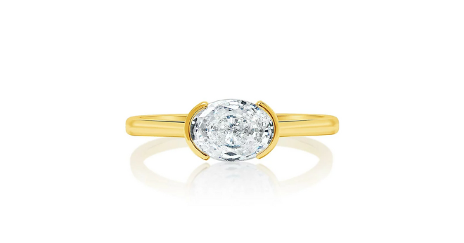 A east west oval half bezel engagement ring available at Zadok Jewelers.