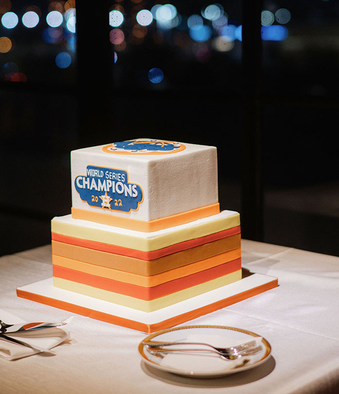 Cakes by Gina designs and Astro world series champions cake for the groom.