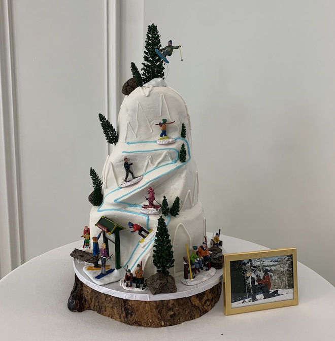 A groom's cake designed as a snow slope as a memory to where they got engaged. 