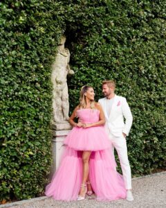 A Poolside Welcome Dinner Detailed in Orange and Pink Hues