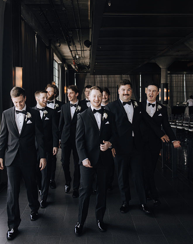 Mandi Roach Photography captures a picture of the groom and his groomsmen.