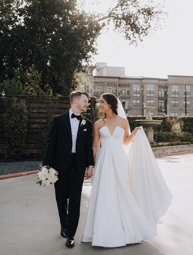 The bride and groom wed with a neutral-toned wedding at The Astorian in Houston.