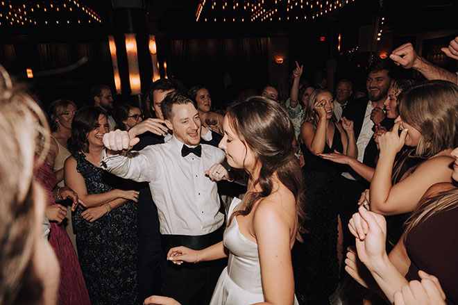 The bride and groom dance at their wedding reception. 