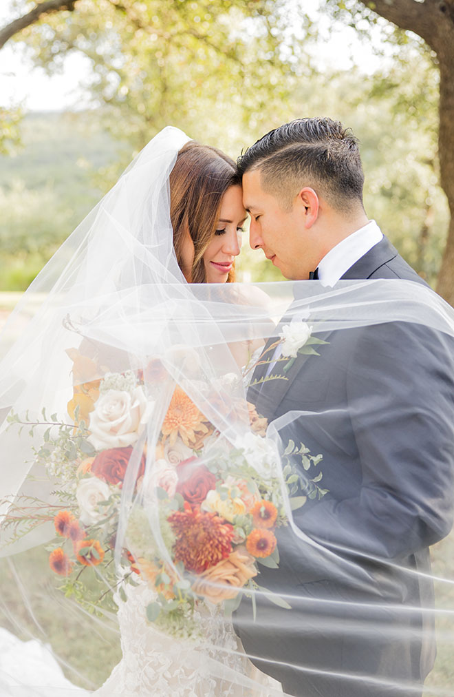 Elizabeth B Photography captures the bride and grooms portraits outside their wedding venue. 