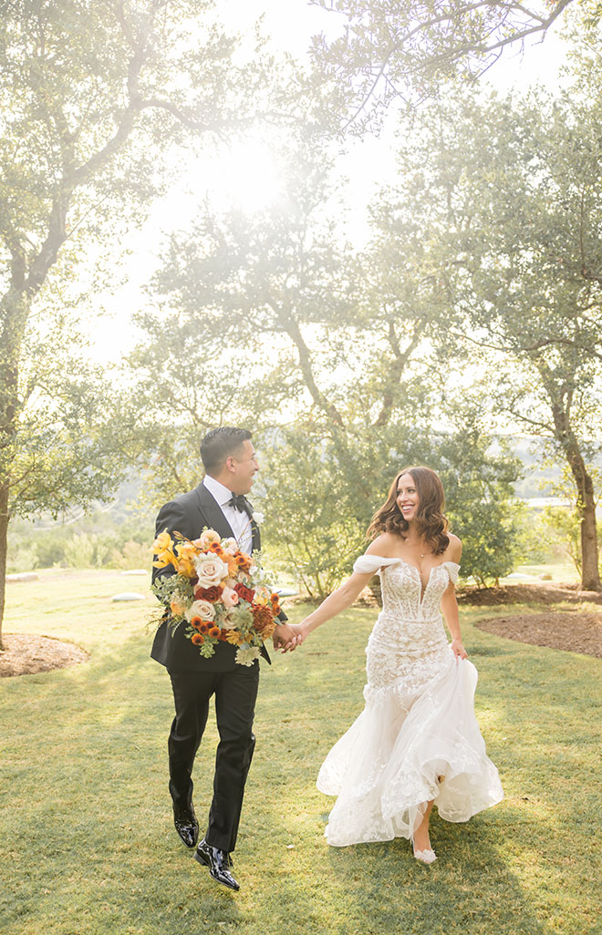 The bride and groom wed with an autumn-inspired wedding captured by Elizabeth B. Photography.