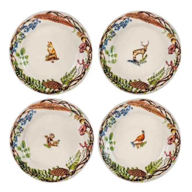 Four dessert plates with fall foliage on the rims with a bird, squirrel, deer and a fox on each plate.