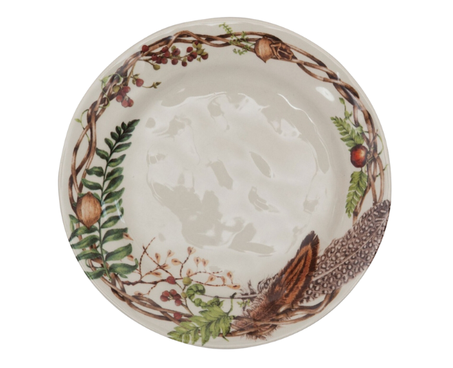 A plate with fall foliage on the rim.