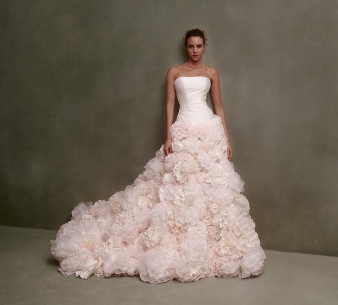 A strapless pink gown with a floral tulle skirt.