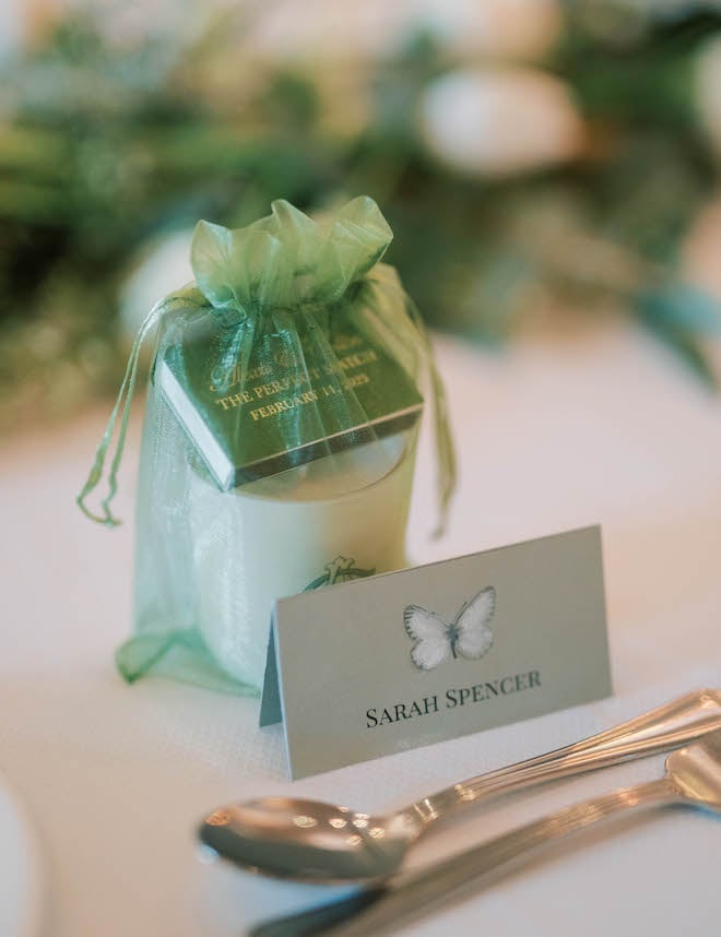 A candle and match boxes are paired together for guests at the reception tables. 