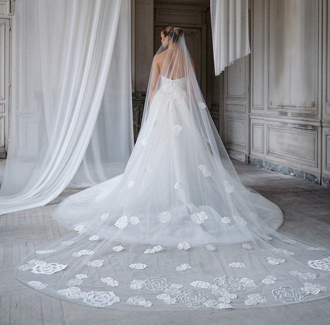 Cathedral length veil with satin embroidered roses in graduating sizes. 