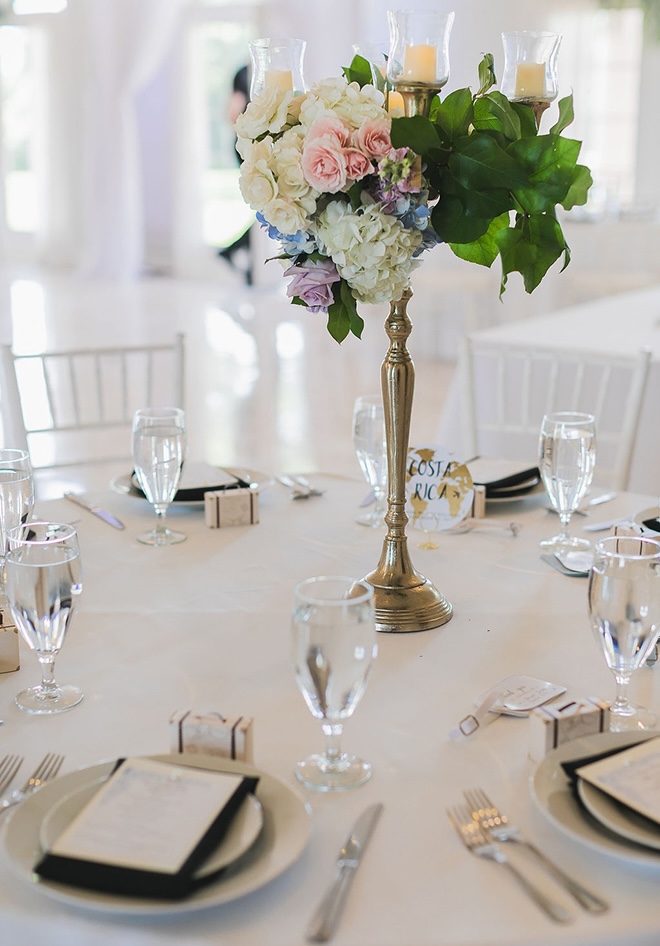 Pastel flowers and greenery decorate the reception tables. 