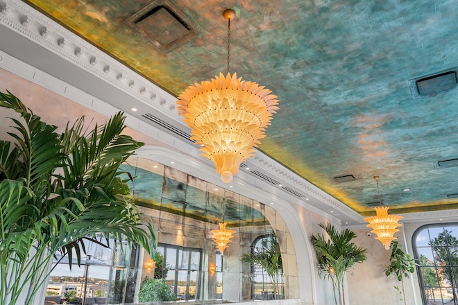 Green copper leaf ceiling with unique chandeliers. 