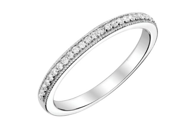 Round diamonds adorn this white gold halfway band and featured a milgrain detail along the edge of the band.