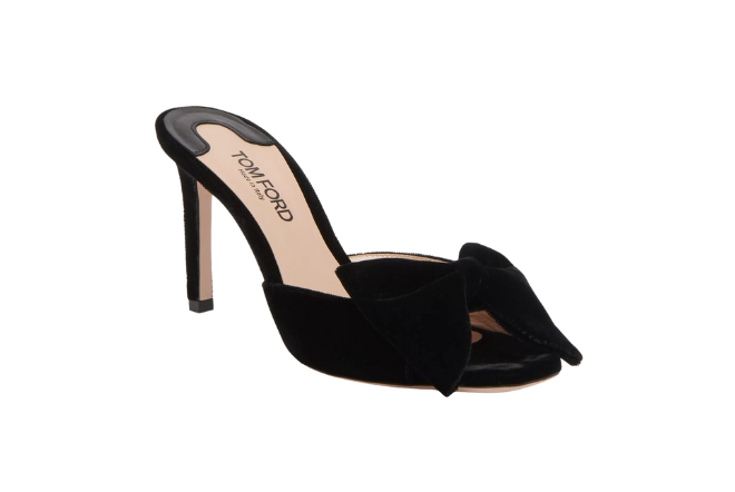 Black, velvet pumps by Tom Ford are available at Saks Fifth Avenue.