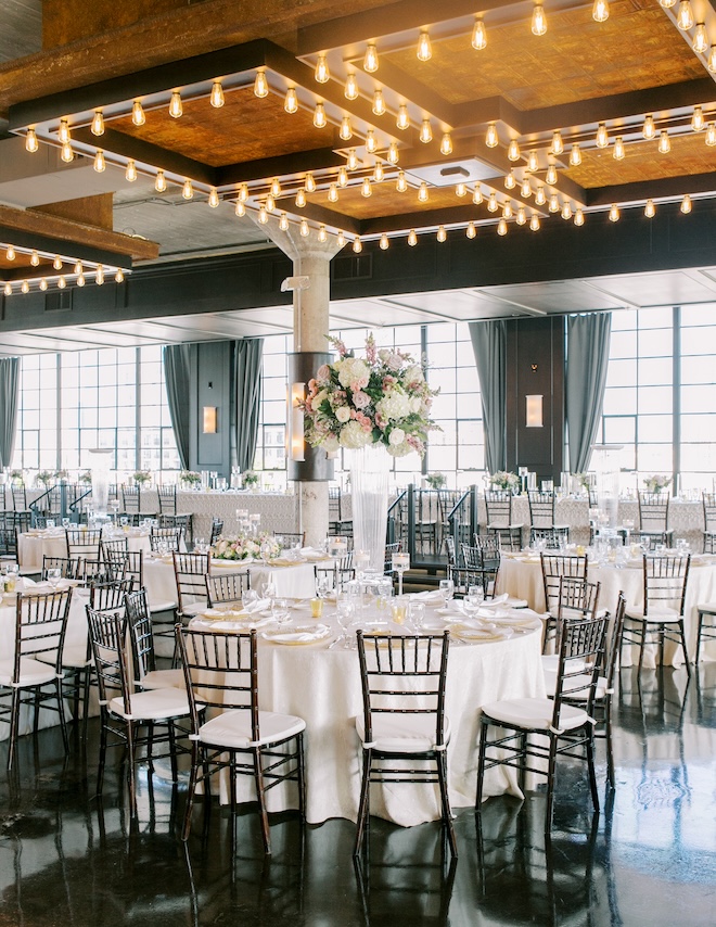 White linens, black chairs and floral centerpieces decorate the Astorian. 