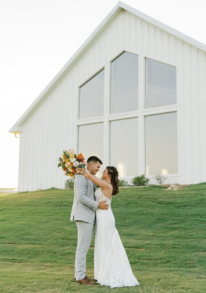 The bride and groom wed with a colorful farmhouse wedding in Montgomery, Texas. 