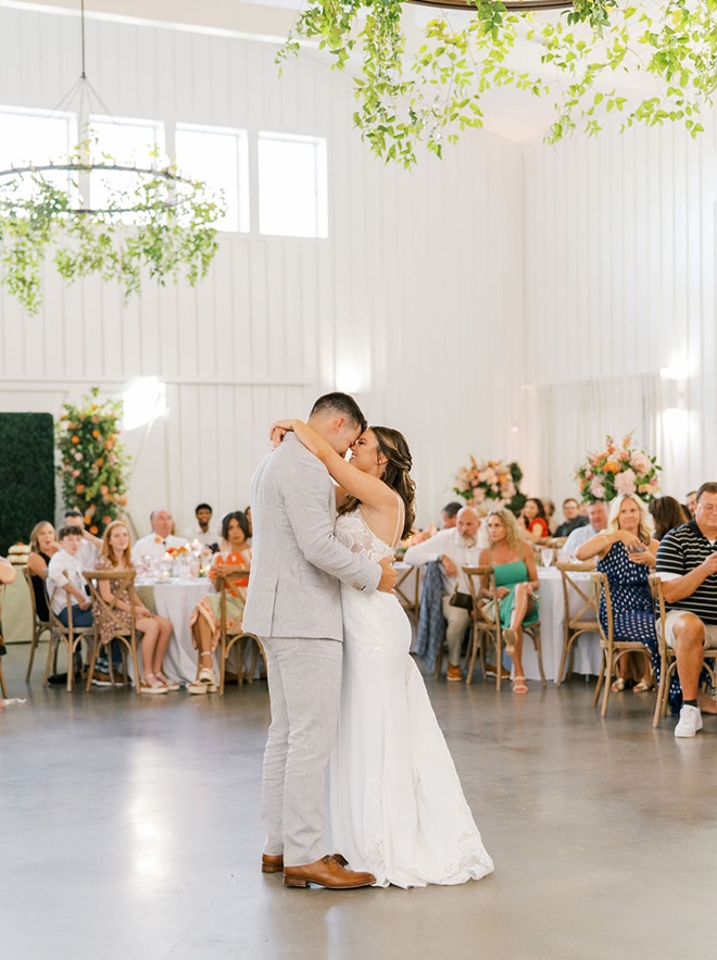 The couple share their first dance in front of family and friends. 