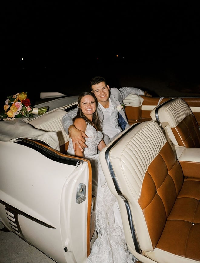 The couple ride off in a white vintage car as their getaway car. 