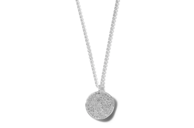 A diamond flower pendant necklace available at Tenenbaum Jewelers.