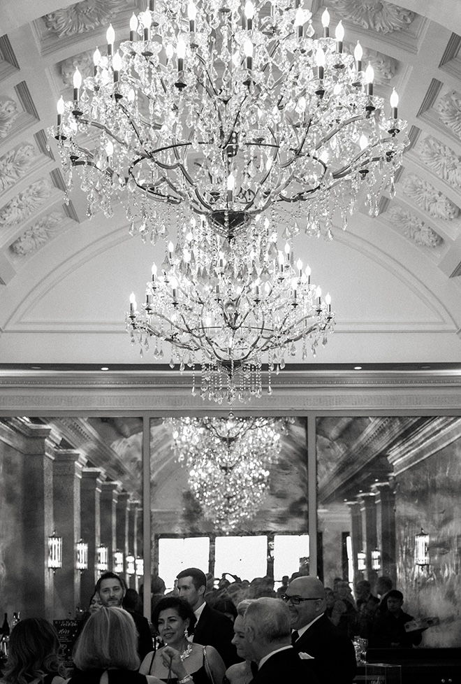 Guests enjoy cocktail hour in the reception lobby at Le Tesserae.