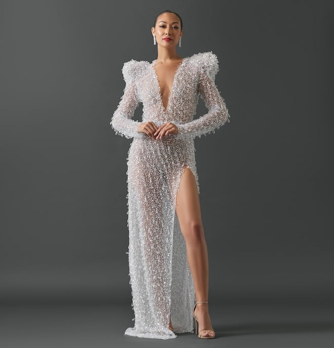 Beaded V-neck gown with large shoulder pads. 