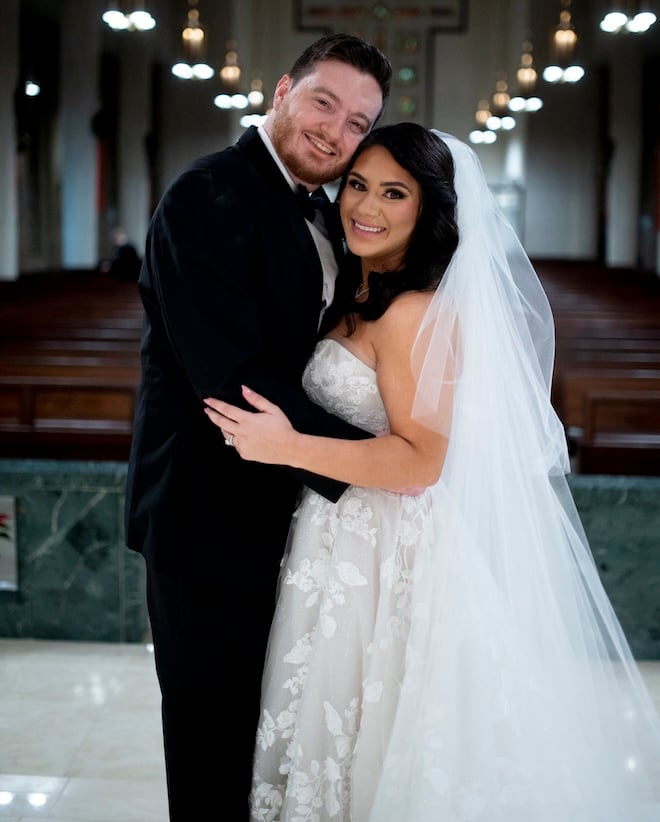 The bride and groom smiling after their traditional church ceremony. 