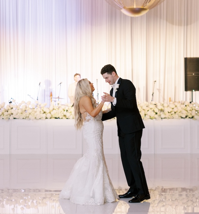 The bride and groom dancing.