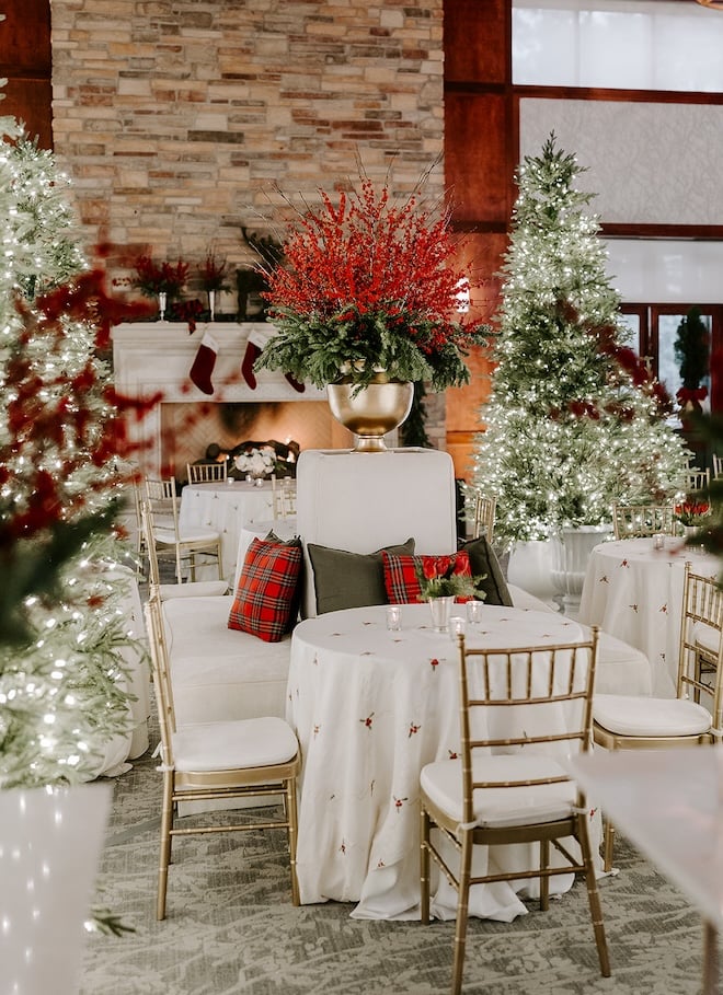 White, green and gold decor for a Christmas wedding reception.