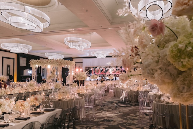 The ballroom at The Post Oak Hotel at Uptown Houston decorated with white and pink florals. 