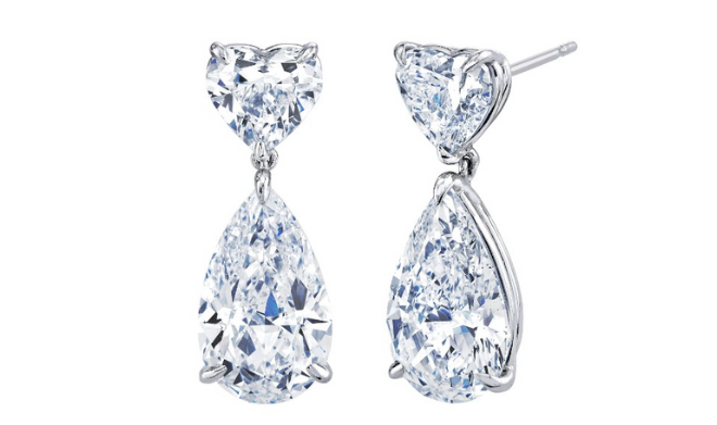 Diamond drop earrings featuring heart-shaped diamonds. 